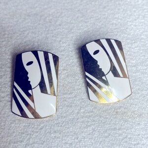 Roman white and gold “Face” clip earrings